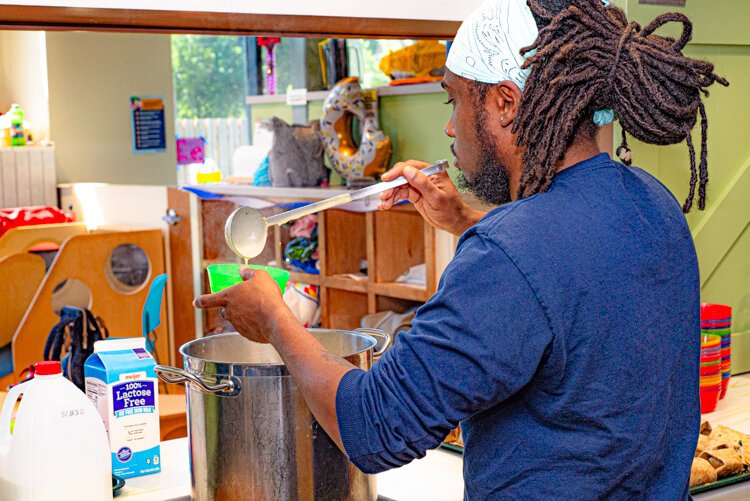 Jomo Upton, Chef at the Edison YWCA, serves up potato soup on the side with turkey and cheese wraps with local spinach and tomatoes.