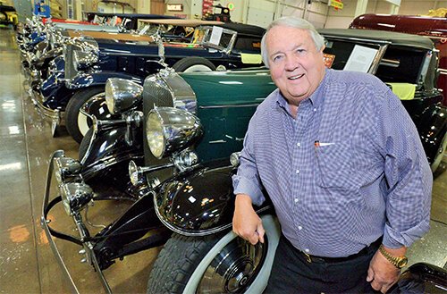TED STAHL: Ted Stahl, owner of Stahls Automotive Foundation standing next to some classic cars in his museum. Credit: Courtesy of Stahls Automotive Foundation. 
