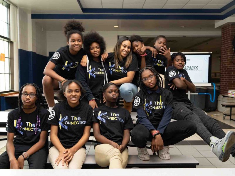 Sharnese Marshall (top row, center), CEO of The Konnection, with Durfee Elementary-Middle School Konnection Klub members