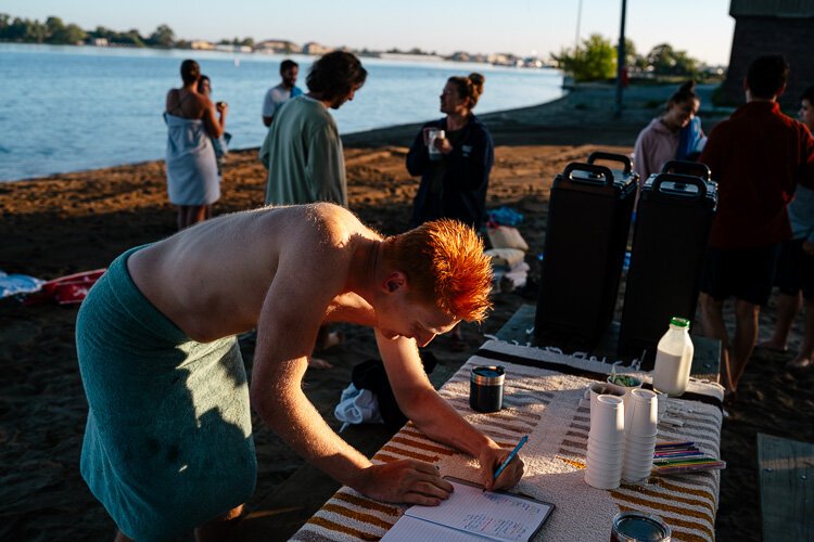 Nick Dal Pra signs into the club after taking a swim.