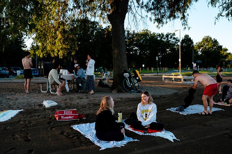 Diandra Gourlay chats with her friend Ellen Duff near the picnic table where swimmers gather for coffee.