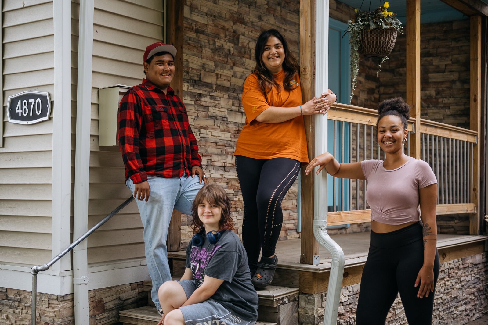 Members of the Detroit Creative Society pose in front of CoC's Youth-Driven Community Center.