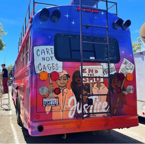 The End of Isolation bus displays a mural by artist DJ Agana. 