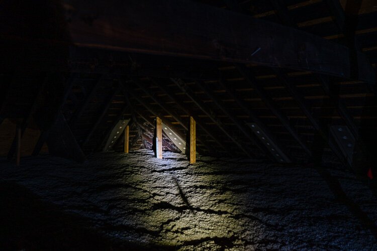 Attic insulation installed at the Payne family's 100-year-old home is designed to increase energy efficiency.