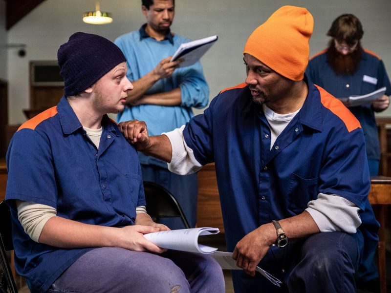 Participants of the men's ensemble rehearse.