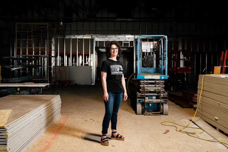 Frannie Shepherd-Bates stands in the construction area that will become the new premises for the Detroit Public Theatre. Photo: Nick Hagen.
