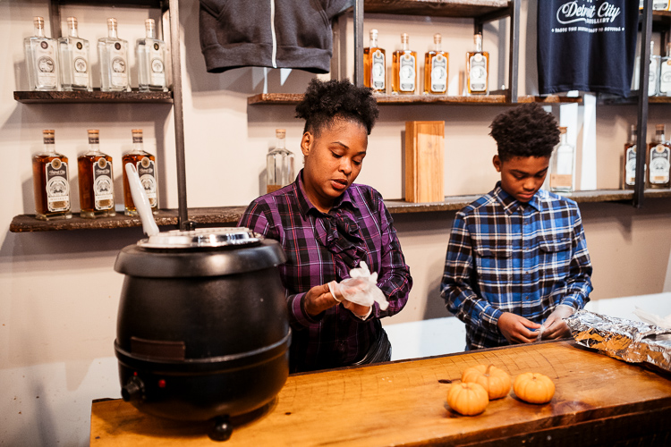 Kamesha McDaniel working with her son Barron at a recent popup at Detroit City Distillery. Photo by Nick Hagen.