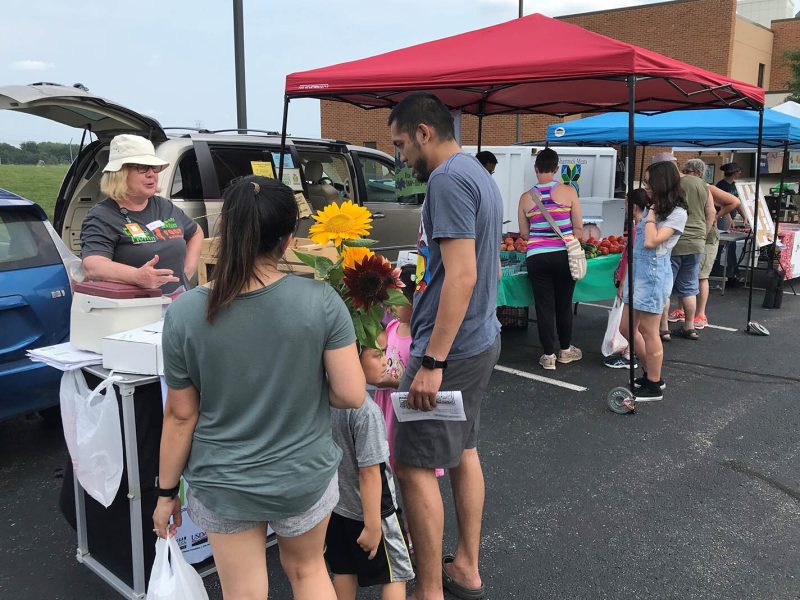 KISD Nutrition Educator Amy Klinkoski at the Kentwood Farmers Market at the Kent District Library's Kentwood branch.