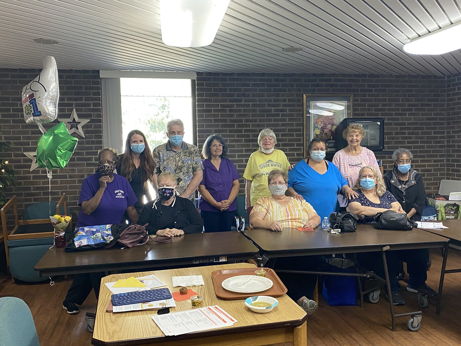 Residents of Burton Senior Center in Burton celebrate completing their Fresh Conversations program with Nutrition Educator Amanda Mattila.