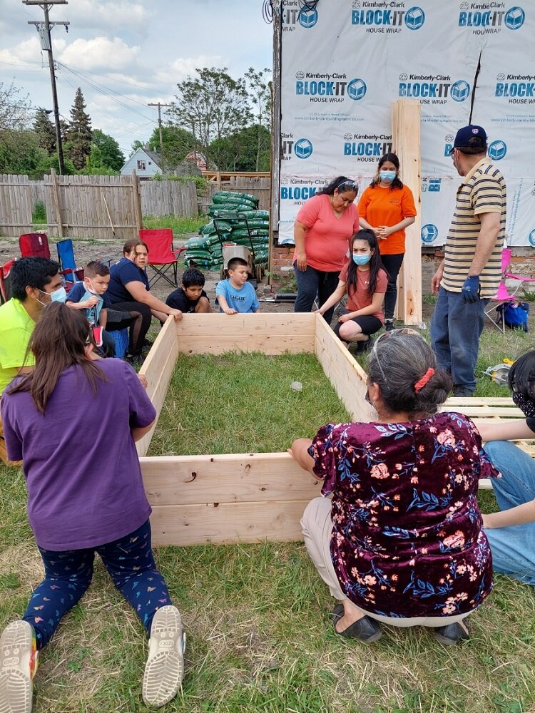 CoC Youth help build a community garden