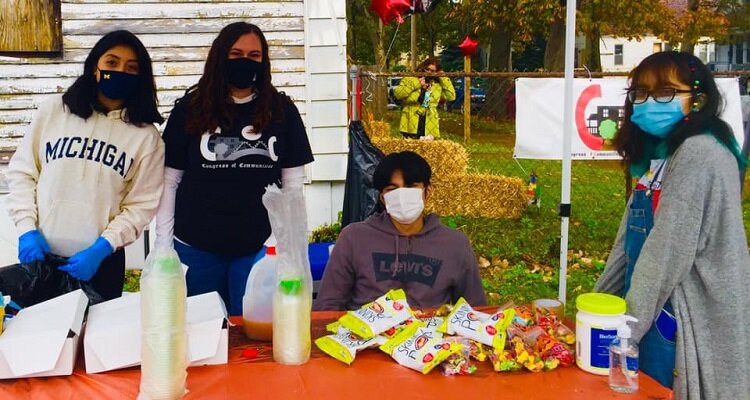 CoC youth help out at a community get together