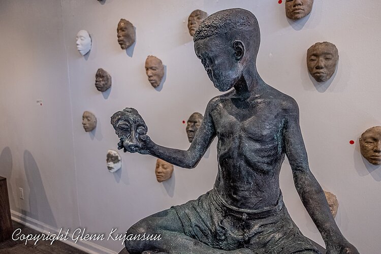 "Boy Holds Flower Within Himself"