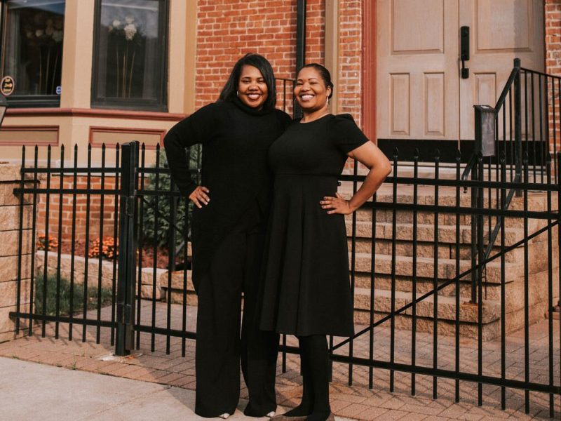 Photo caption: Sisters Roderica and Francina James pose outside their luxury bed and breakfast.  Courtesy photo.