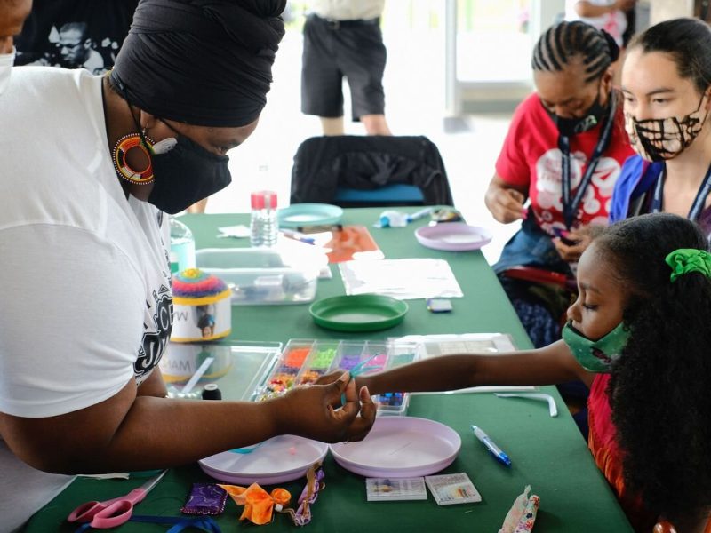 Participants create memorial pouches for the Healing Memorial.