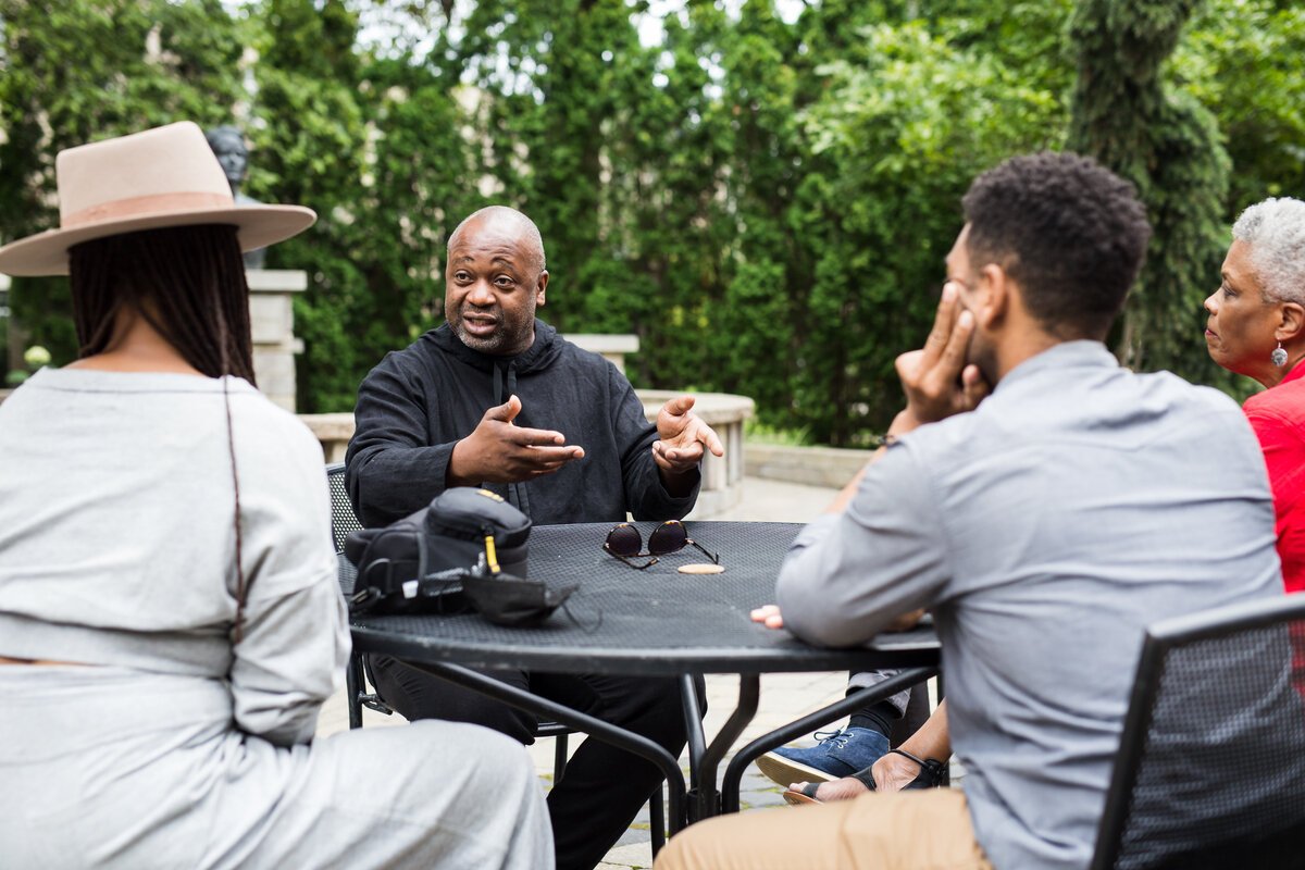 Danielle Eliska, Mario Moore, and Rochelle Riley listen as Theaster Gates speaks.