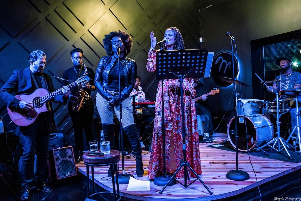 Ideeyah Supreme (left) and jessica Care moore (right) perform together at "Miss Eva's".