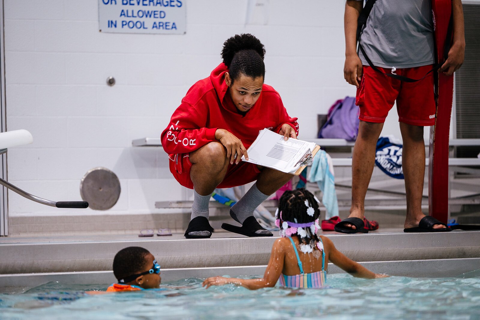 Raymond Harris teaches a water safety class at Adams Butzel Complex in Detroit.