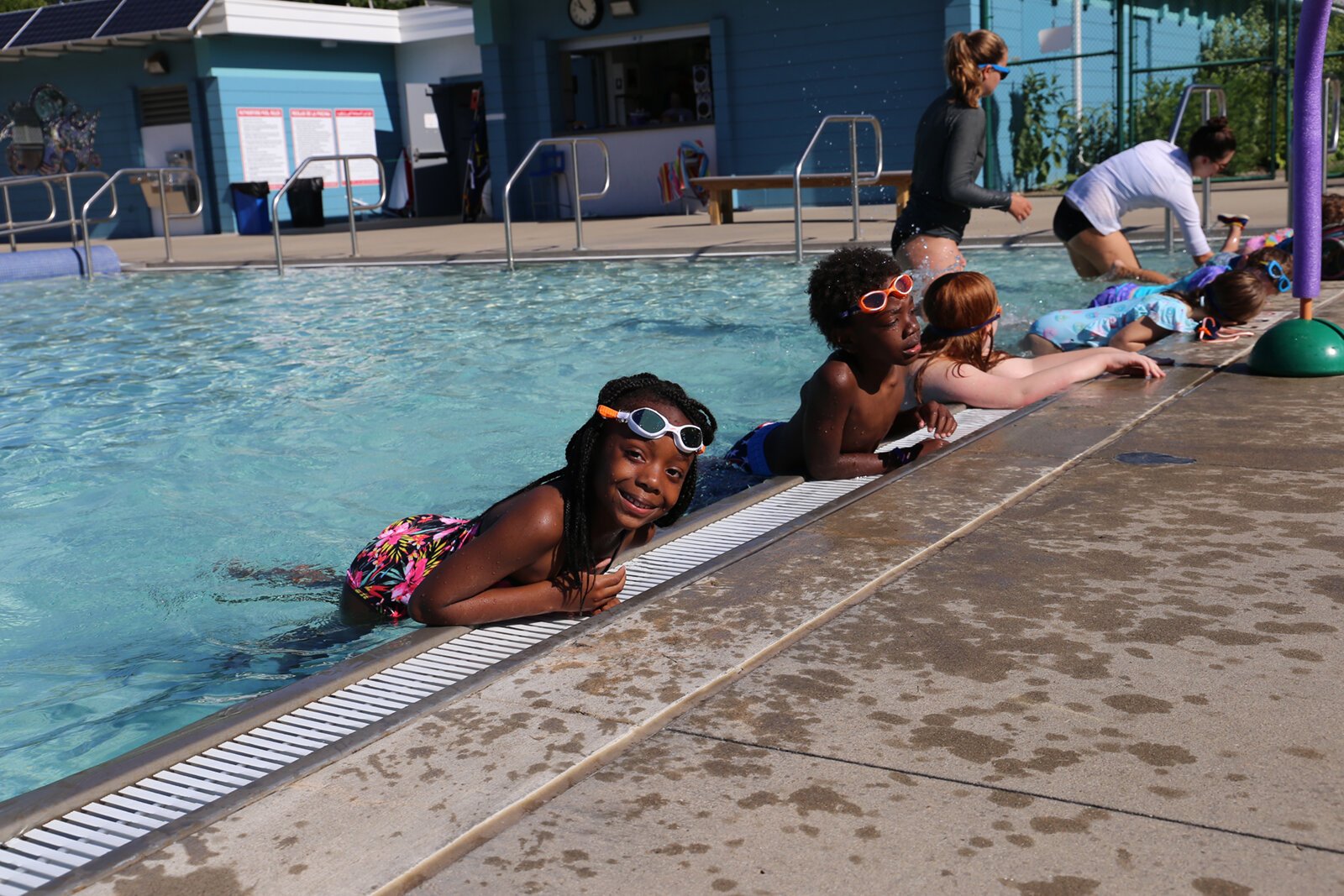 Kids participate in an Everyone in the Pool swimming lesson.