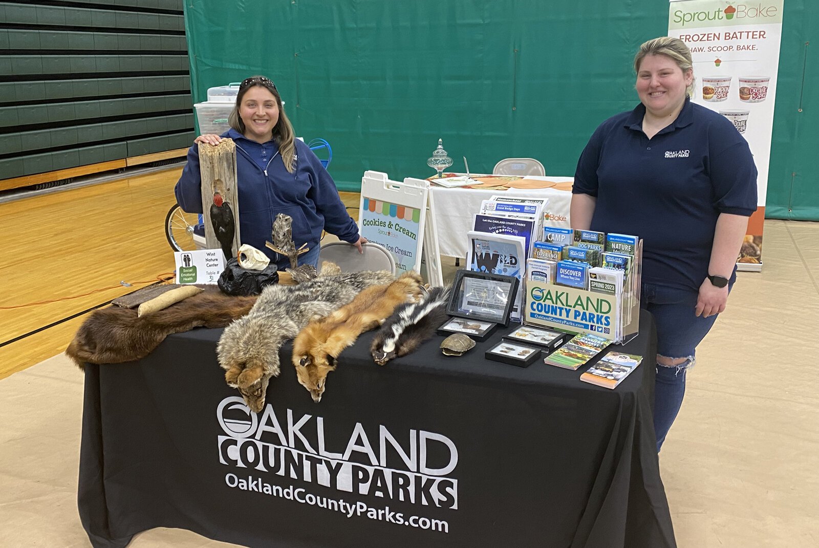 Oakland County Parks staff at a nature table.