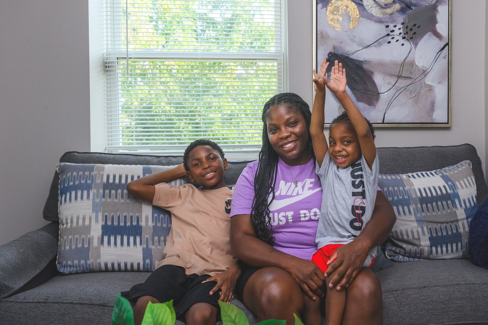 Dallas, Jamillyah, and Dayton Palmer in their new home in Pontiac.
