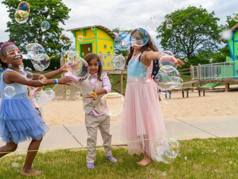 Kids play on the Detroit Riverfront.