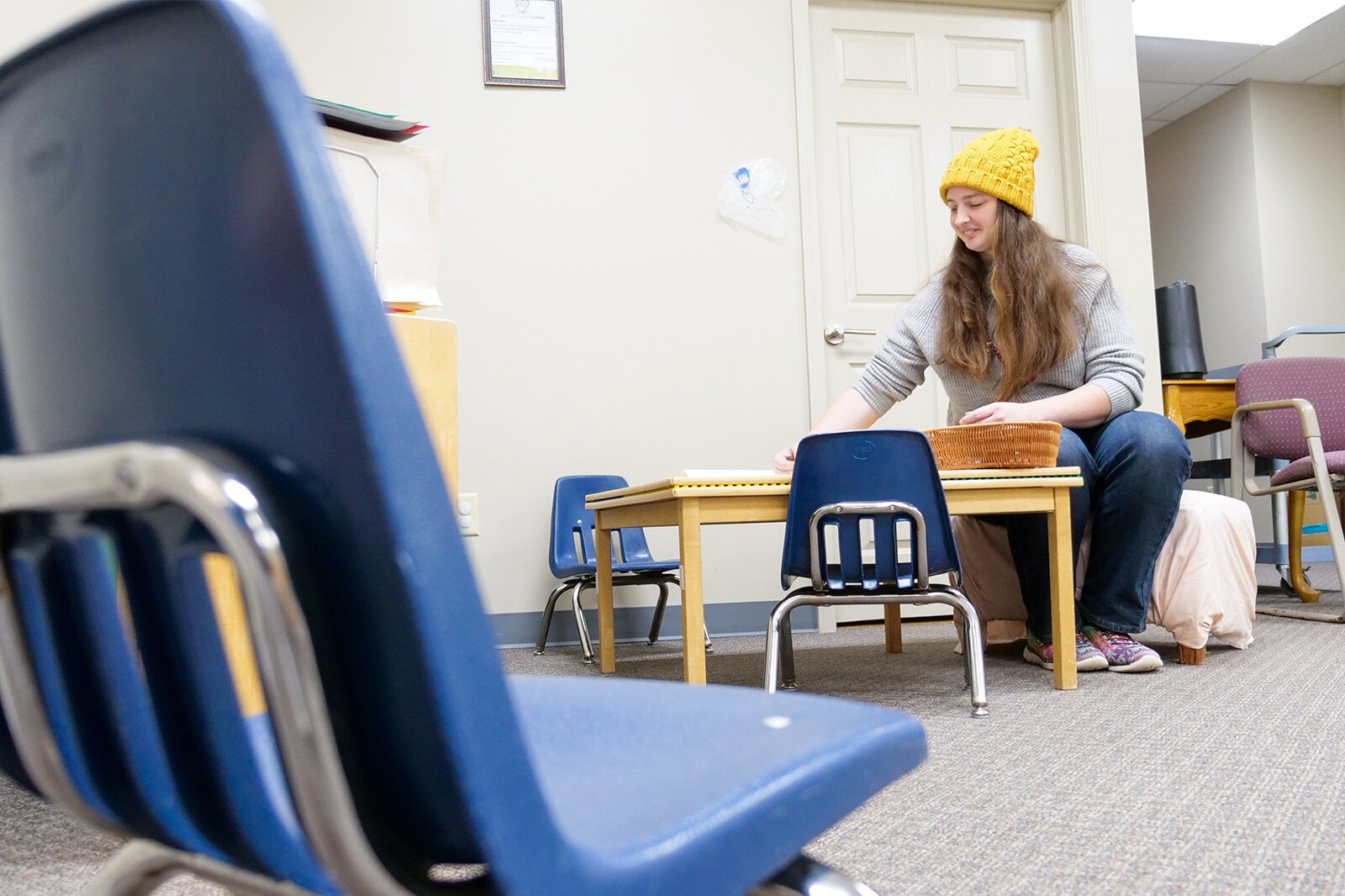 Director Samatha Mitchell prepares for Children's Discovery Academy grand re-opening. The center offers weekly indoor activities for families. A $5/group suggested donation raises funds for the center's construction.