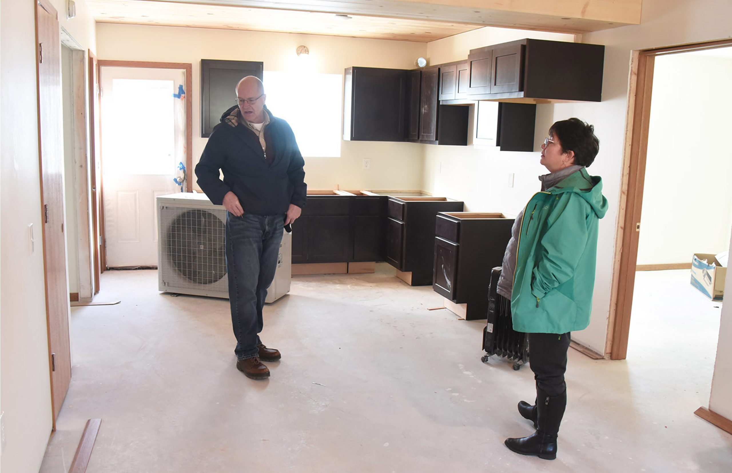 Yarrow Brown and Jon Stimson check out the interior of affordable Vineyard View Apartments in Suttons Bay.
