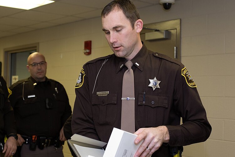 Sanilac County Sheriff's Office Sergeant Michael Moore opens his new iPad.