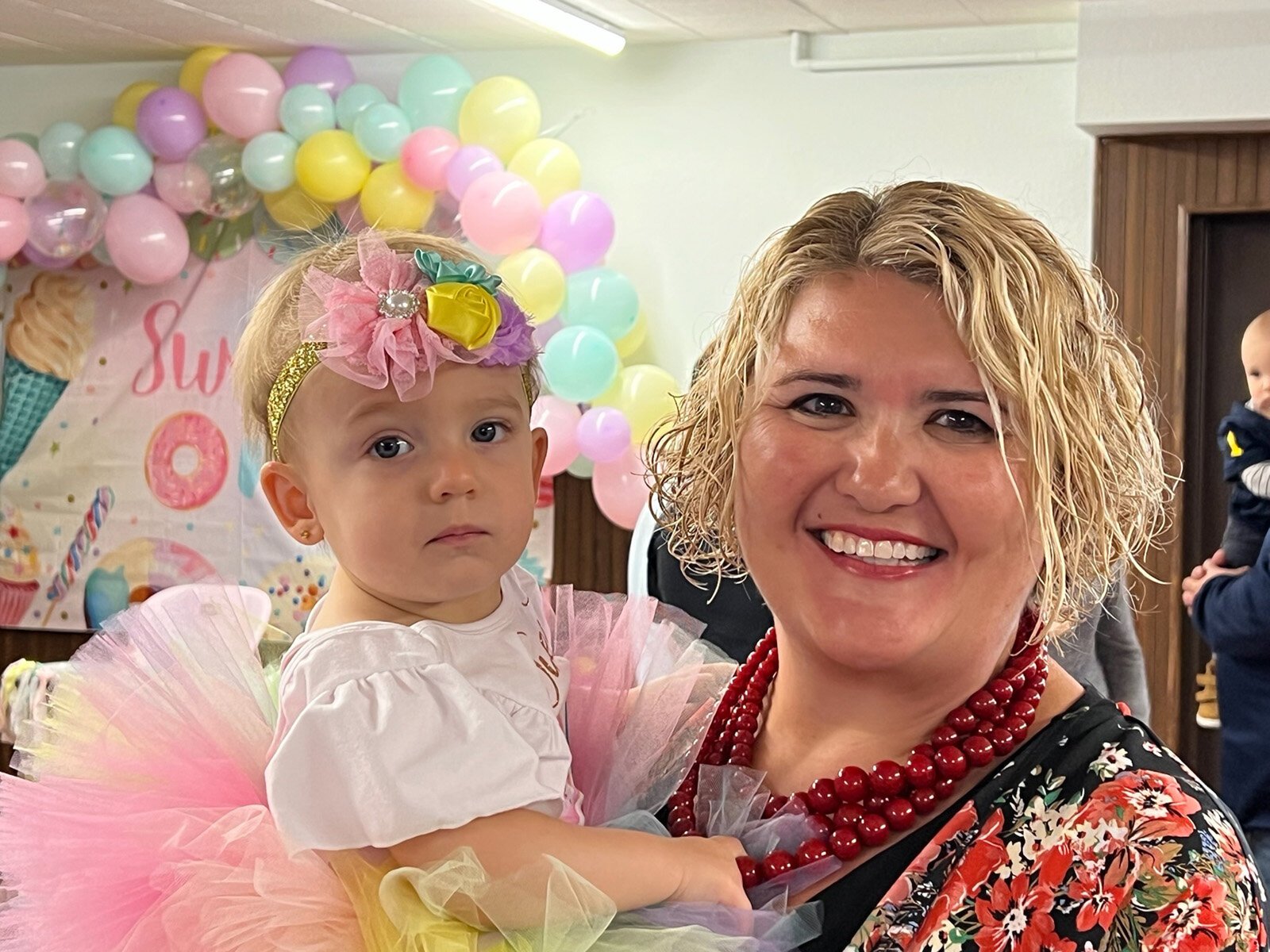 Alissa Parnicky holds a child.