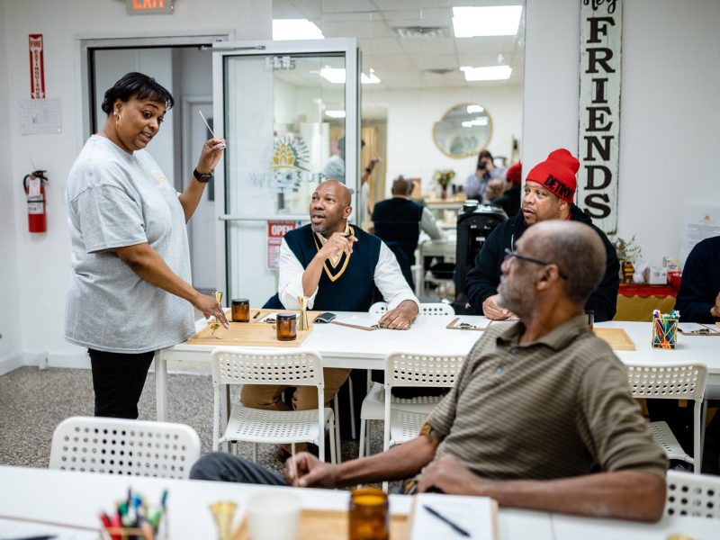 Aisha Sanders, owner and creator of Wicksup Candle Co. in Oak Park, explains the candle making process to a Food and Friendship Connections group.