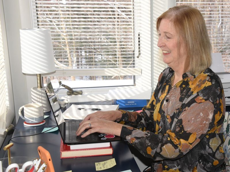 Jenifer Murray, a contracted grant coordinator with Munson Healthcare, works on programs for new parents in her office.