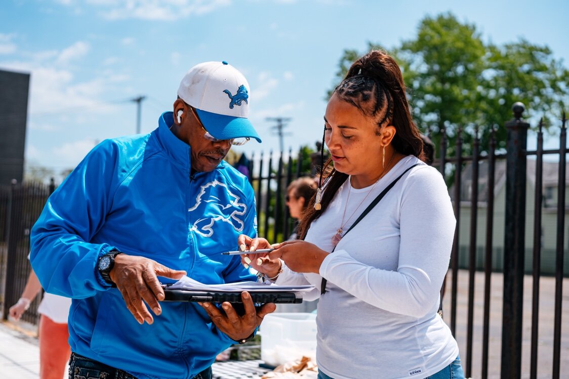 Chantel Watkins out gathering signatures for One Fair Wage.