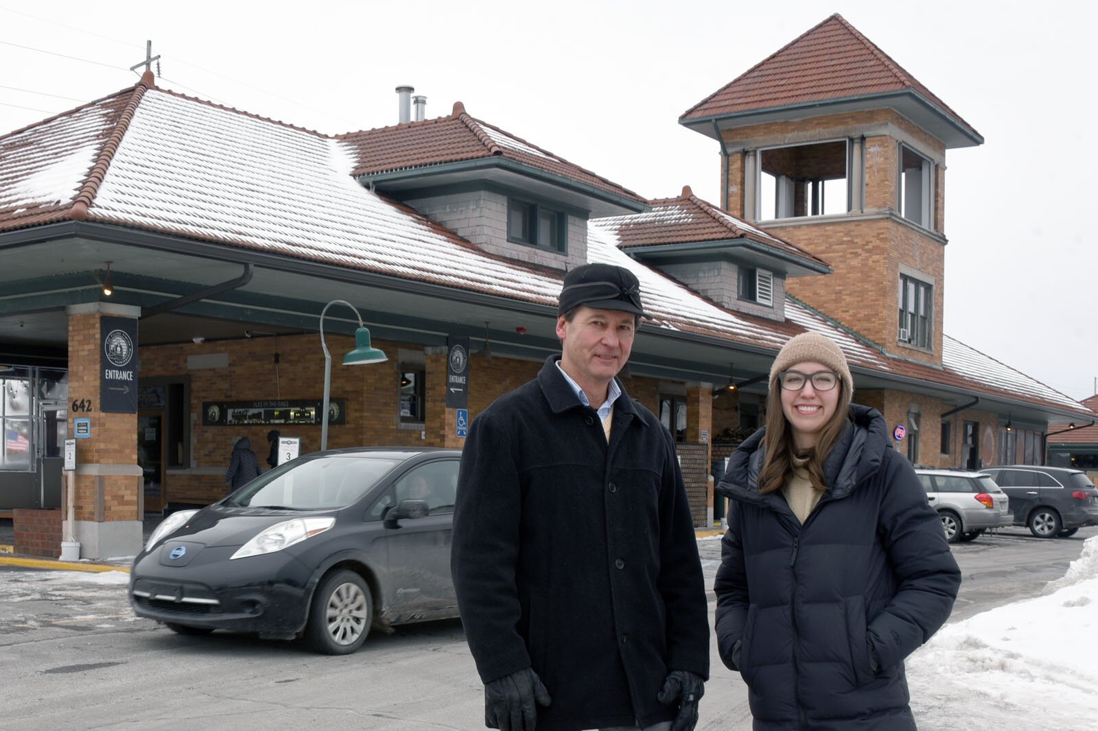 Retired Traverse City Planning Director Russ Soyring and Groundwork Center Transportation Program Manager Carolyn Ulstad at Traverse City's train depot, now the site of The Filling Station Microbrewery.