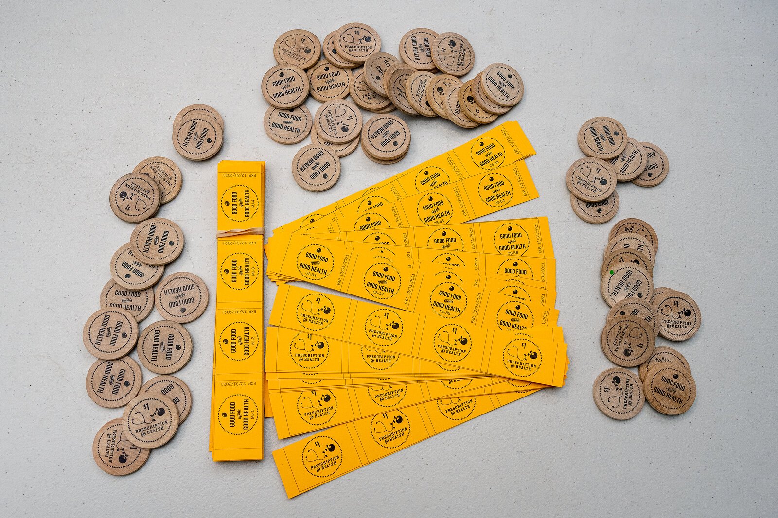 Prescription for health program participants can exchange these tokens and tickets for healthy food.