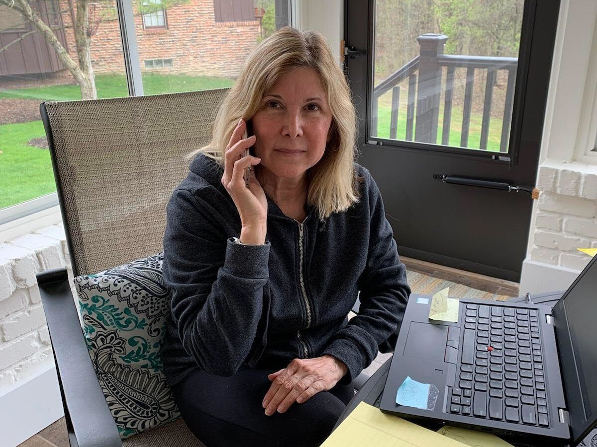 A Catholic Charities of Southeast Michigan staffer makes a friendly reassurance call from her home.