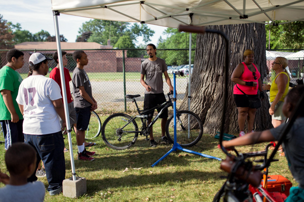 Back Alley Bikes offering a bike maintenance class during the Northwestern Detroit Market