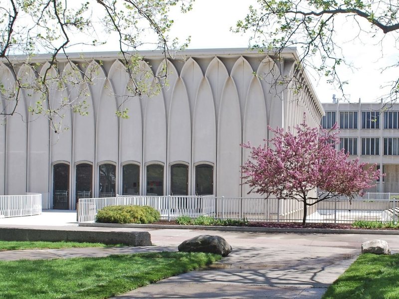 The Helen L. DeRoy Auditorium on the campus of Wayne State University and its surrounding reflection pool, seen here empty to the right of the building's foundation.