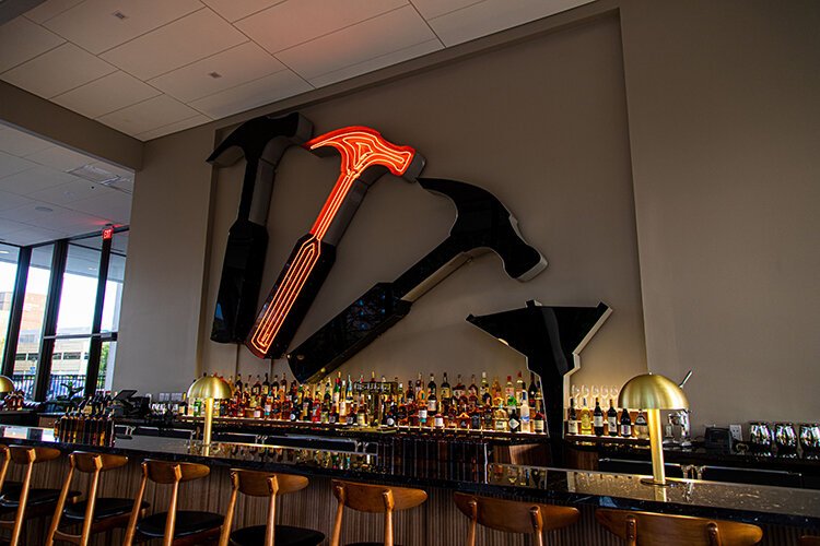 Once adorned atop the Professional Plaza building, the series of neon hammer-and-nail signs served as a beacon in the Detroit sky, and is now seen at Hammer & Nail cocktail bar.