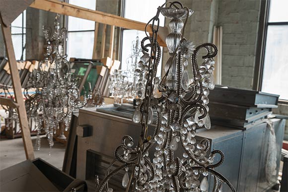 The original chandeliers await restoration in storage at the Higbee bldg