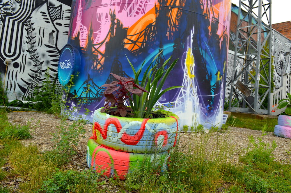 Green Living Science educates students on how to reuse materials like making tires into planters.